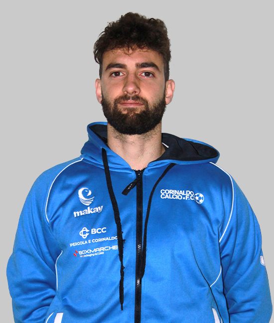Ritratto a mezzo busto di calciatore con barba, felpa tecnica azzurra con cappuccio e logo Corinaldo Calcio F.C., su sfondo grigio neutro.